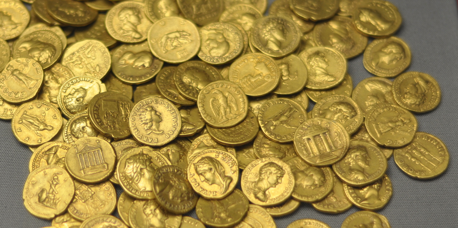 Gold aureus coins with the faces of various Roman Leaders. These coins were found below the floor of a Roman house in Corbridge in 1911. From the British museum.